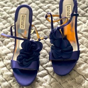 Tall hills, fabric flowers on the front, strap, platform.